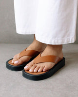 Overcast tan flip flop
